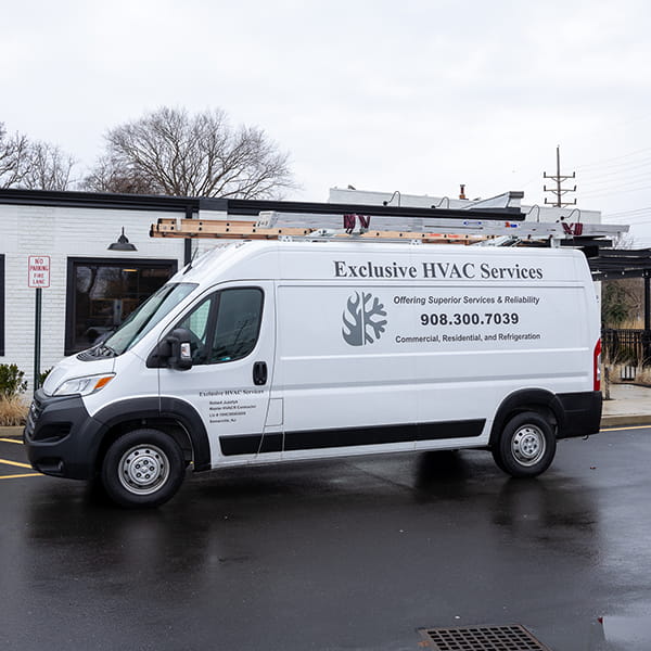 Technician performing commercial AC repair and service