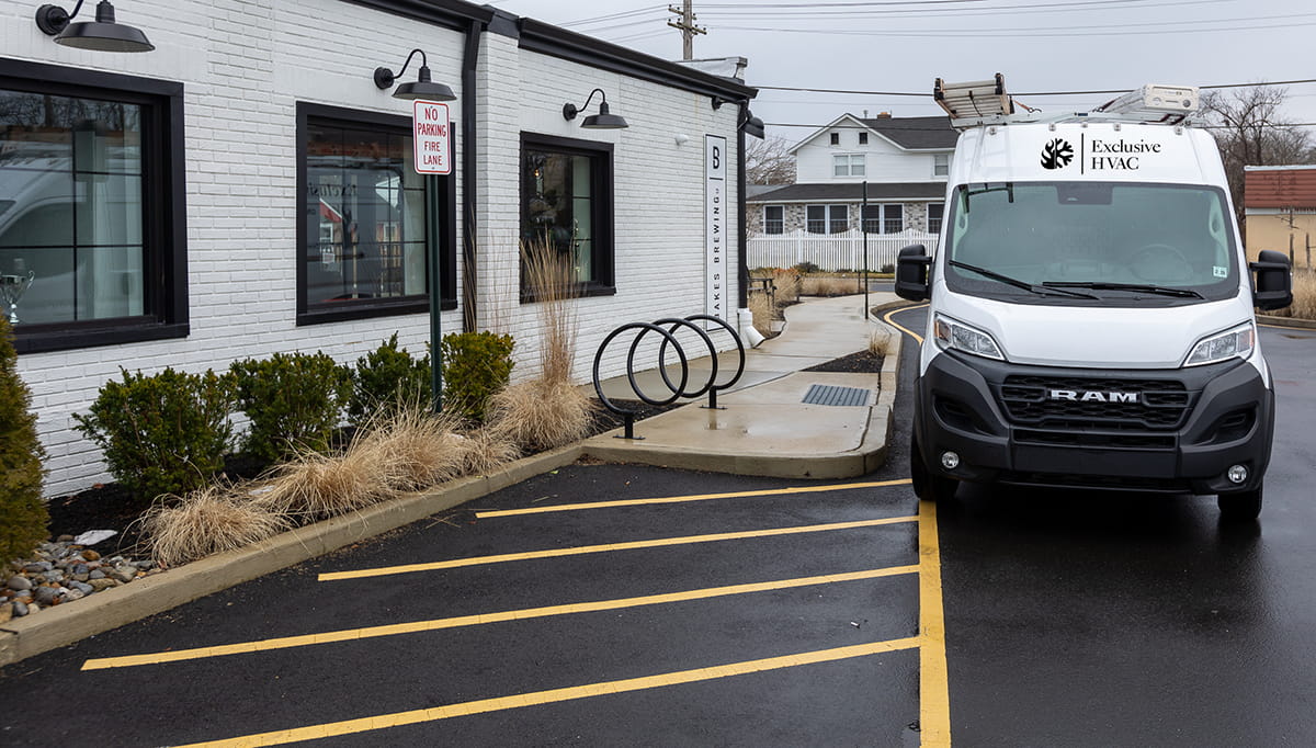 Technician performing emergency HVAC repair in New Jersey commercial building